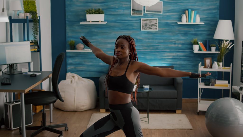 young-woman-wearing-sportswear-training-leg-stand-posture-sitting-yoga-map-living-room